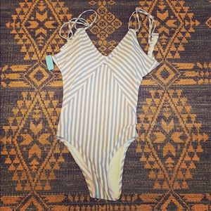 Grey and white striped one piece bathing suit